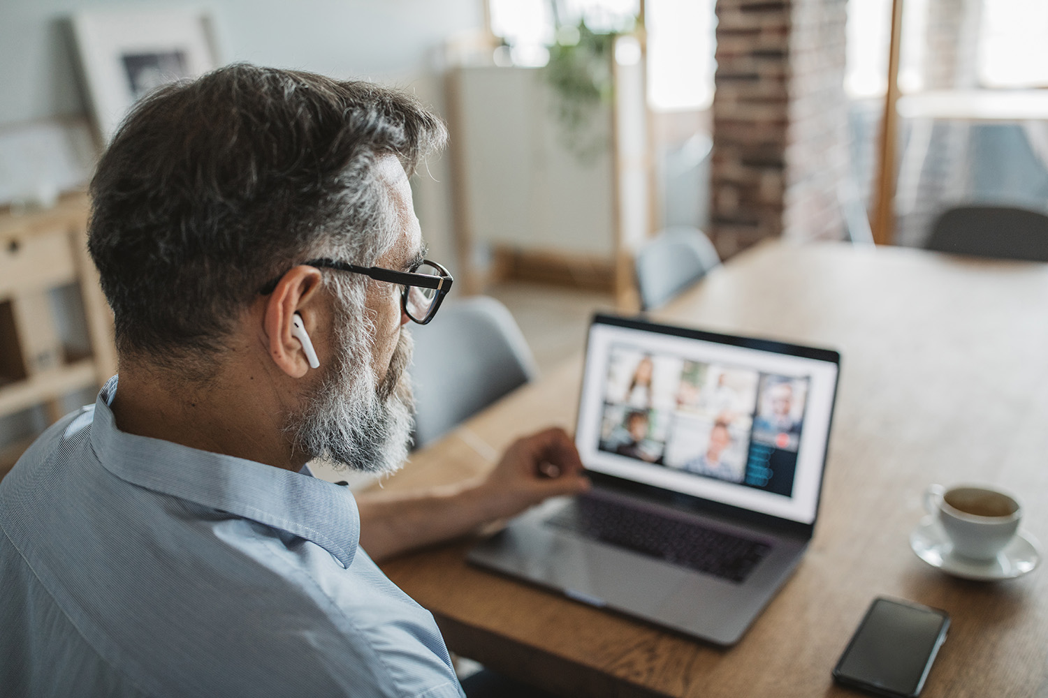 Man at laptop on video conference