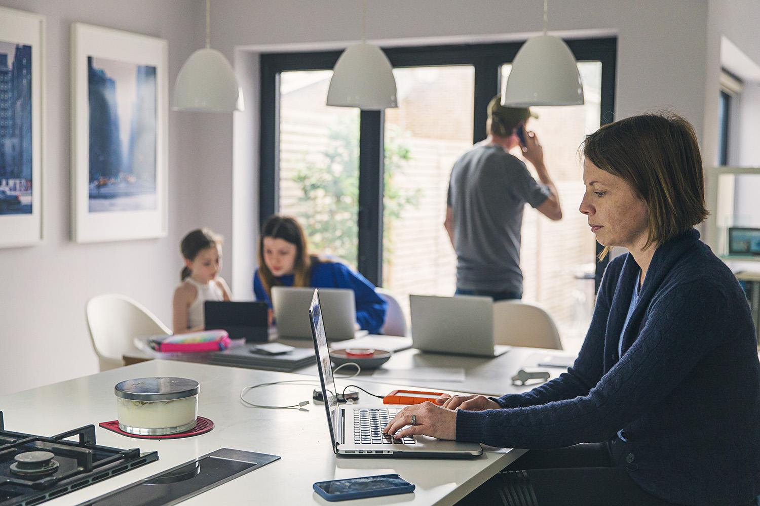 Young women trying to work from home with interruptions